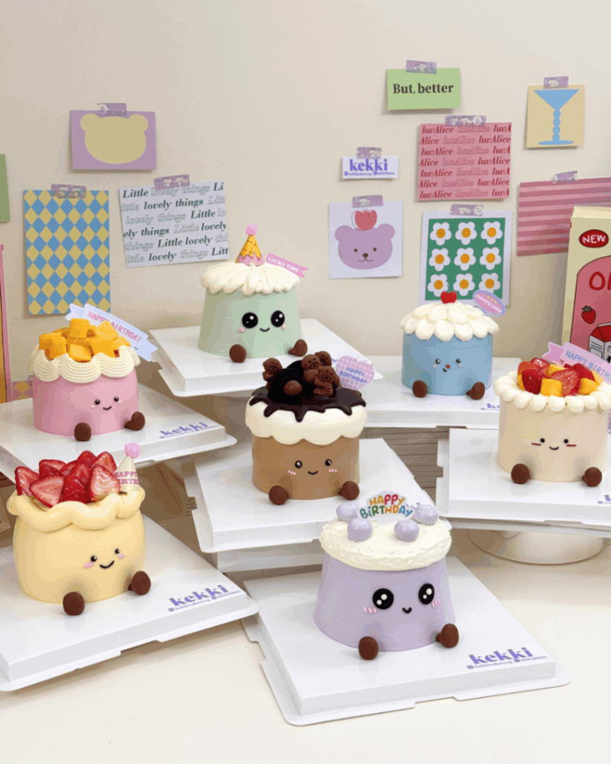 Seven pastel Kekki plushie cakes displayed together